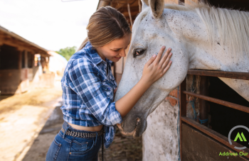 A woman hugging a horse thumbnail